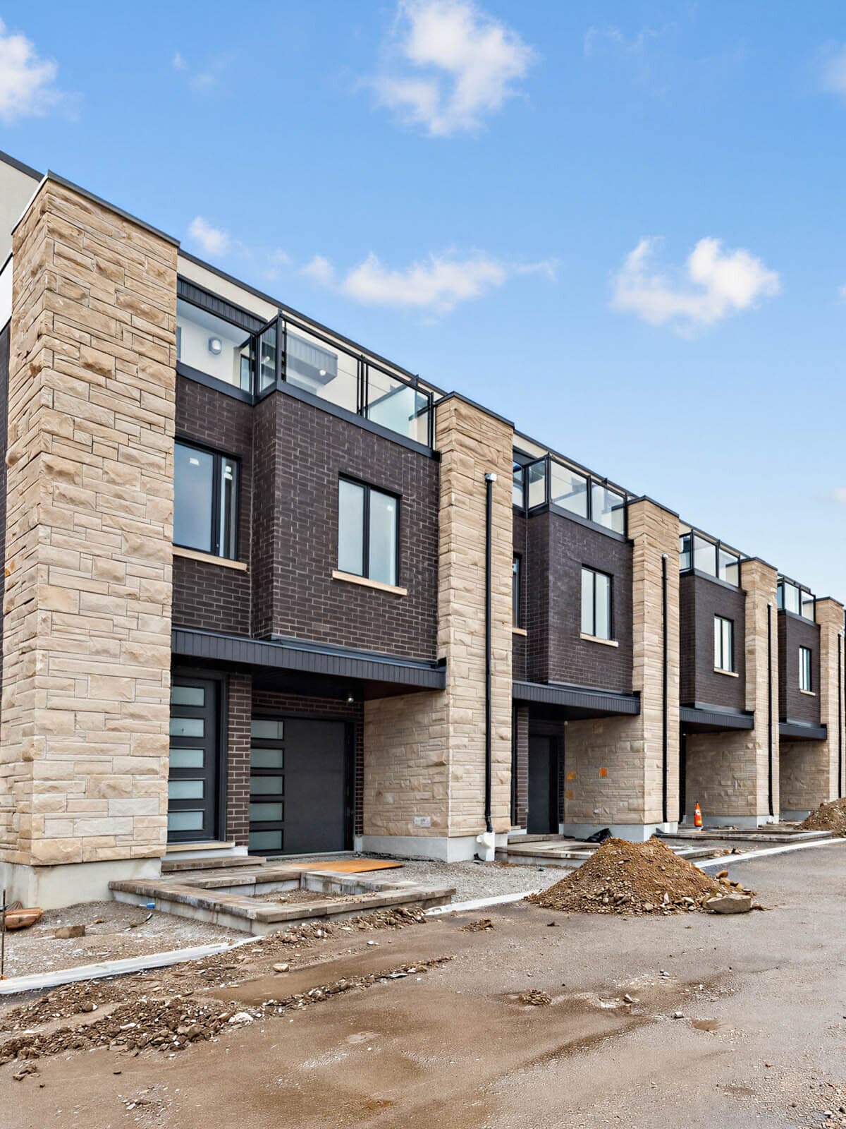 Charcoal brick and limestone piers of the front elevation